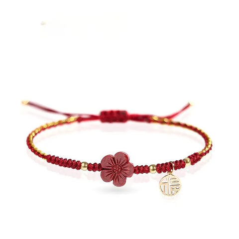 Rotes Schnurarmband mit kleinem roten Blumenanhänger - Viel Glück und Energie